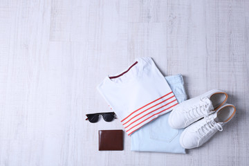 Stylish male clothing set on wooden background