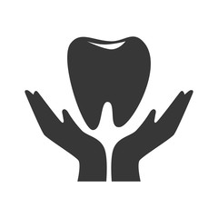 silhouette hand holding a tooth vector illustration