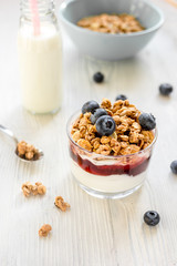 Healthy morning with granola breakfast on white kitchen table