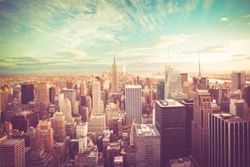Tuinposter Vintage tone view of New York City skyline view across Manhattan © littleny