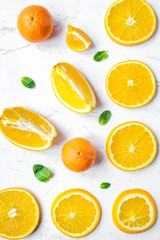 Slices for orange juice on white background top view pattern