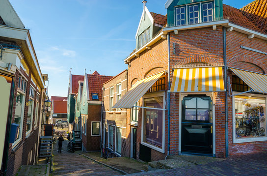 Traditional houses and small vessels in Holland town Volendam, Netherlands