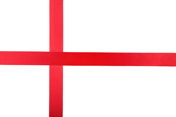 Obraz premium Bright red satin ribbon cross pattern on white background for gift wrapping and holiday decoration, this elegant design is suitable for various festive occasions and celebrations