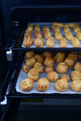 Freshly baked eclairs and profiteroles