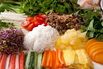 Fresh vegetables, delicious meat, rice noodles, rice wrapped with rice paper - obrazy, fototapety, plakaty