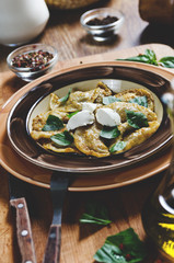 agnolotti with lamb. pasta stuffed with cream cheese and red pesto