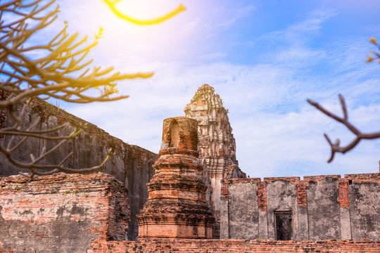 Old ancient pagoda in Lopburi thailand, with Old Exterior Brick Wall Background vintage style grung texture