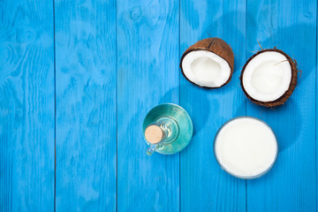 Coconut oil on a blue wooden background