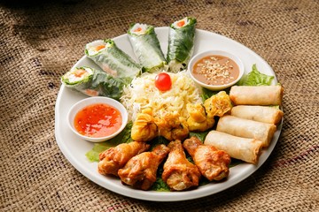 Fresh vegetables, various rolls of meat and crispy fried