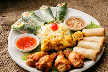 Fresh vegetables, various rolls of meat and crispy fried