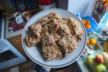 rustic simple crumble on plate for breakfast with raspberries, blueberries