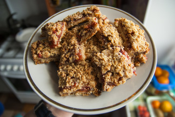 rustic simple crumble on plate for breakfast with raspberries, blueberries