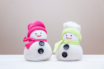 Handcraft toy snowmen made from socks and rice. Step six. Do it yourself in spare time. Kids craft art.