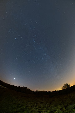 Astro landscape with the Milky Way and the bright Venus as seen from the Palatinate Forest in Germany.