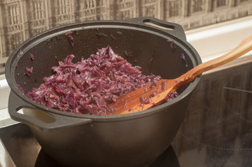 cooking dinner from a cabbage in black pot