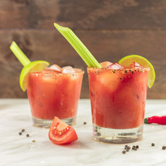 Bloody Mary cocktails with celery and lime