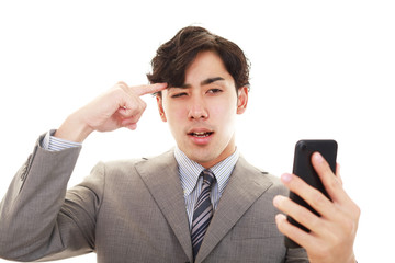 頭痛を訴えるビジネスマン
