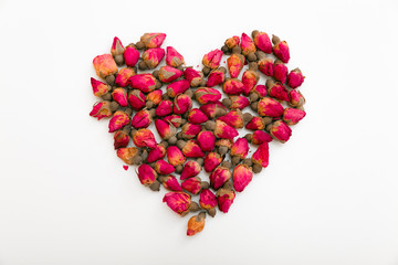 Heart of pink buds on a white background