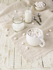 white cup with cocoa and marshmallows, selective focus