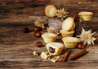 small round Christmas cakes with nuts and cinnamon, space for text