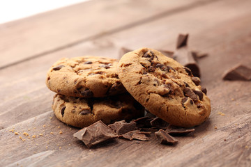 Chocolate cookies on wooden table. Chocolate chip cookies shot