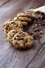 Chocolate cookies on wooden table. Chocolate chip cookies shot