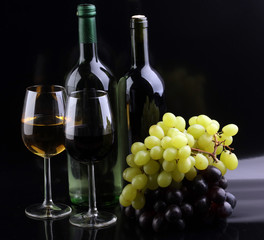 Fototapeta premium Wine glass and Bottle on black background. Red and white wine