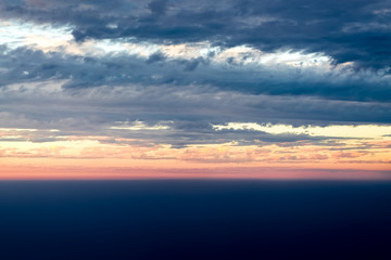 Naklejka na ściany i meble View sunset with sky and cloudy from airplane window when flying,Nature background