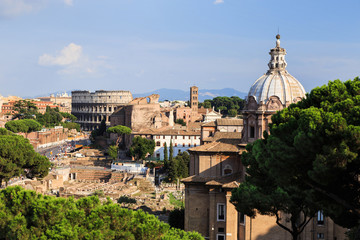 Aerial view of The Colosseum and Chiesa dei Santi Luca e Martina in Rome, Lazio, Italy