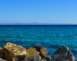 Fototapeta na wymiar The sea and large stones Greece. Kassandra. Halkidiki