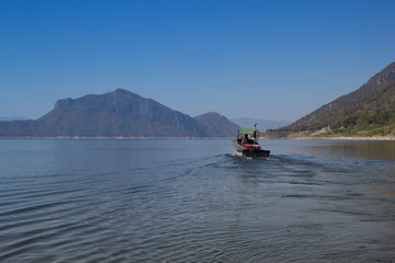 The Boat in Ping River, View of Bhumibol Dam, Tak province, Thailand.