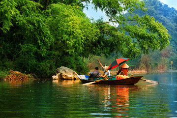 Traveling by boat on streams YEN in Hanoi, Vietnam.