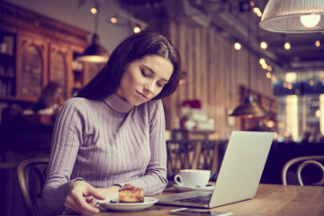 woman working with laptop in cafe. social network concept