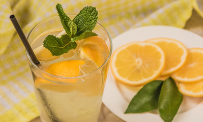 Fresh lemonade in glass with mint and ice