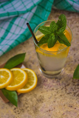 Fresh lemonade in glass with mint and ice