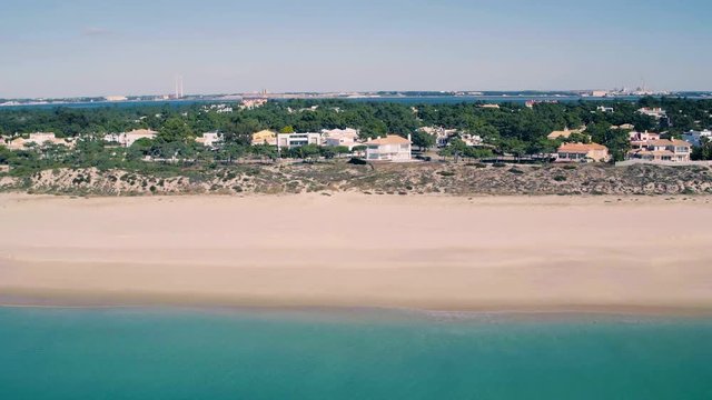 Flying Above Holiday Village on Shore Ocean