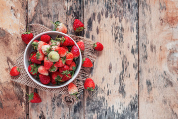 strawberries on wooden floor.