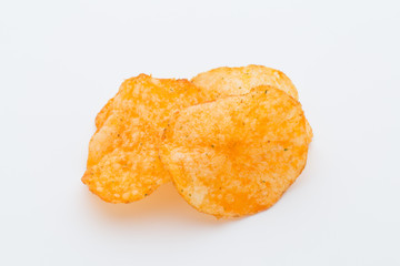 Crisps with paprica on a white background.