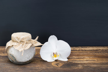 flower white orchid on a table with sea salt