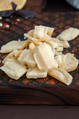 Parmesan cheese on a wooden rustic board