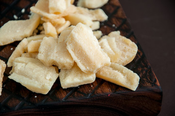 Parmesan cheese on a wooden rustic board
