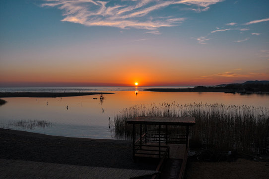 Fisherman's boat silhouette at sunset © dzejdi