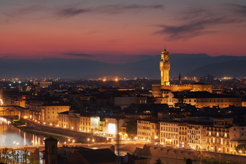 Beautiful view of Palazzo Vecchio in evening illumination and the river Arno, Florence, Italy