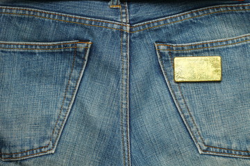 Fototapeta premium The gold bar put in the jean pocket background represent gold and business finance concept related idea.