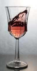 wine splashing in a glass