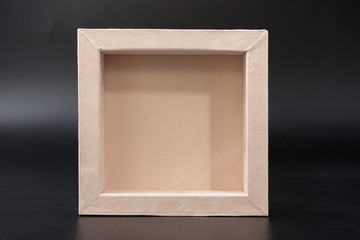 an empty box on a black background. casket.