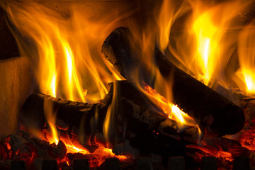 The fire in the fireplace burning wood