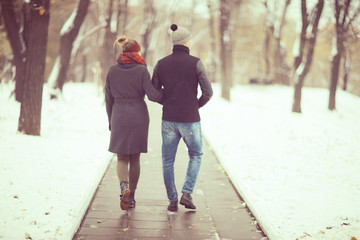 Fototapeta premium loving couple walking in the city view from the back