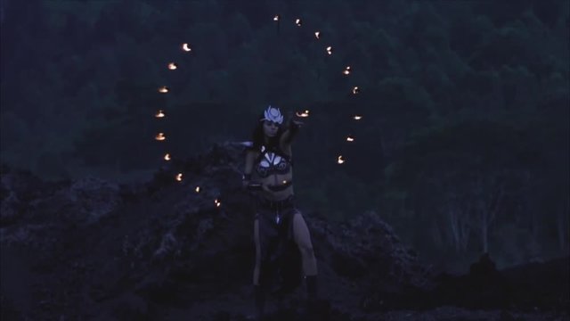 Woman dancing with fire in the volcano Batur, Bali, Indonesia. Slow-motion 