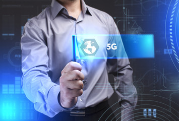 Business, Technology, Internet and network concept. Young businessman showing a word in a virtual tablet of the future: 5G